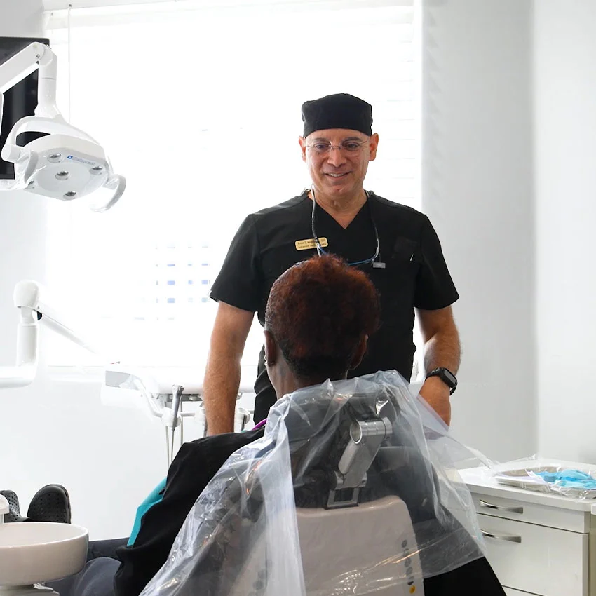 Dr. Armen Mergerdichian treating a patient at Gardena Dental Group